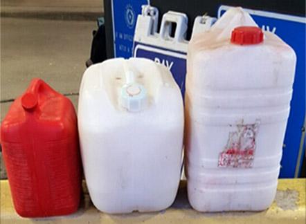 Three fuel containers containing 45 gallons of pulque